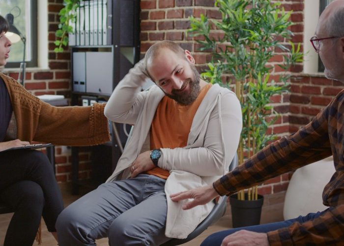 man-with-anger-management-issues-attending-aa-group-therapy-meeting-receive-support-guidance-angry-person-with-mental-health-problems-talking-people-rehabilitation-program